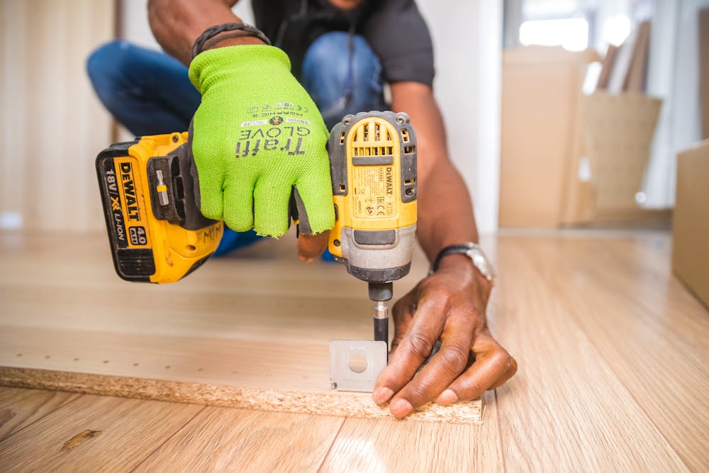 a man building a DIY wooden storage box